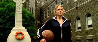 Immaculata College's new head coach Cathy Rush (Carla Gugino) awaits her players with the school's one basketball at her side.