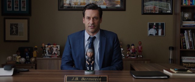 In "Million Dollar Arm", sports agent J.B. Bernstein (Jon Hamm) uses a bobblehead doll to try to land a major NFL player.