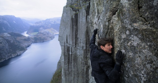 Ethan Hunt (Tom Cruise) clings to a cliff in Kashmir in the overlong climax of "Mission: Impossible - Fallout."