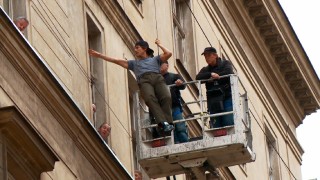 A casual Tom Cruise rehearses the first of his elevated wire stunts in "Suiting Up in Prague."