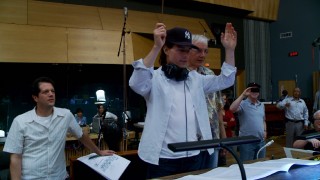 With composer Michael Giacchino's approval, Tom Cruise tries his hand at conducting an orchestra through a performance of the famous Mission: Impossible theme.