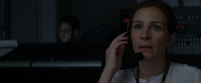 Ever the professional, director Patty Fenn (Julia Roberts) keeps the show on the air and running as safely as she can.