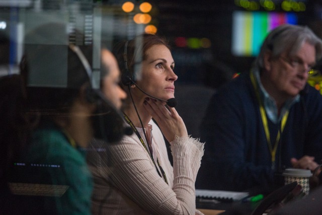 Patty (Julia Roberts) keeps her cool in the booth, directing "Money Monster" as a televised hostage situation.