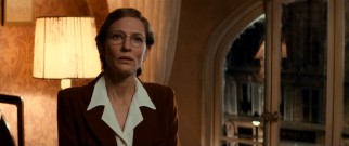 Cate Blanchett adopts a French accent and a serious demeanor as Claire Simone, a curator who assists The Monuments Men.