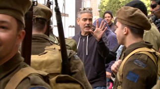 George Clooney dresses down to direct his castmates in "George Clooney's Mission."