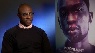 Screenwriter-director Barry Jenkins discusses "Moonlight" next to the film's creative poster art.