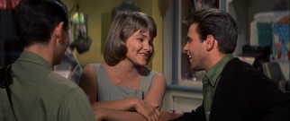 Shy teenaged daughter Katey (Lauri Peters) shows her braces while singing the Mancini-Mercer duet "Cream Puff" with Joe (Fabian).