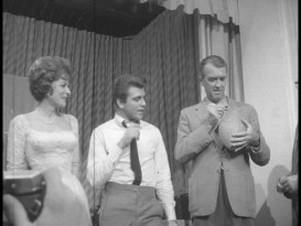 In one of the stranger movie-promoting photo ops, Maureen O'Hara and Jimmy Stewart autograph a football for the University of Minnesota's team in this Fox Movietone newsreel.