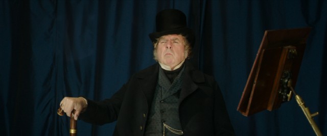Mr. Turner (Timothy Spall) strikes a handsome pose for his first daguerreotype photograph.