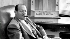 "The Incredible Mr. Lippert" shows producer Robert L. Lippert poses proudly at his desk, with a cigar in his mouth and "Baron of Arizona" ad behind him.