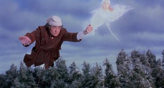 The Ghost of Christmas Past leads Scrooge (Michael Caine) on a flight through time.