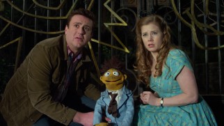 Gary (Jason Segel), Walter, and Mary (Amy Adams) cast their eyes on Kermit the Frog himself.