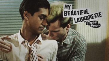 Omo and Johnny share an embrace on the My Beautiful Laundrette Blu-ray top menu.