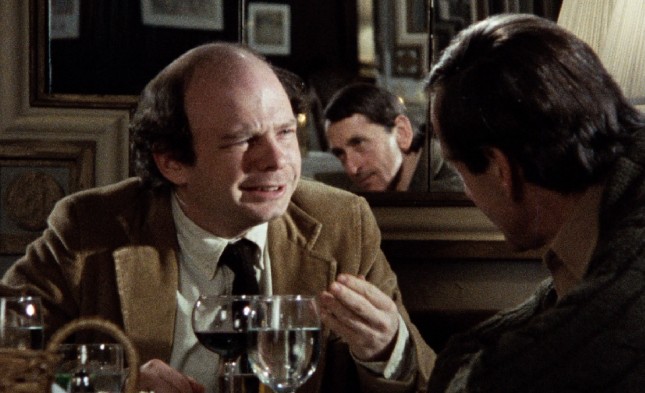 How do you get the faces of two men sitting across from each other at a table in the same shot? With a mirror! That's using your head, Louis Malle!