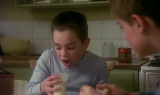 Young Ingemar Johansson (Anton Glanzelius) has a nervous habit of shaking his glass and making a mess when going for a sip.