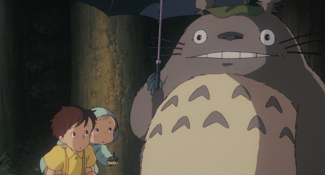 While awaiting their father at a rainy bus stop, Satuski and Mei lend an umbrella to the big Totoro who then makes the rain stop.
