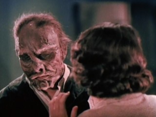 The monster is revealed when his wax mask shatters.