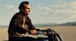 In the desert, Freddie Quell (Joaquin Phoenix) picks a point off in the distance and takes a fast motorcycle ride there and beyond.