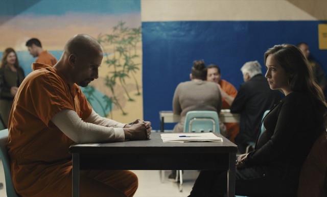 Roman (Matthias Schoenaerts) has a strained visit with his pregnant teenaged daughter Martha (Gideon Adlon), nearby a ludicrous tropical photo wall.