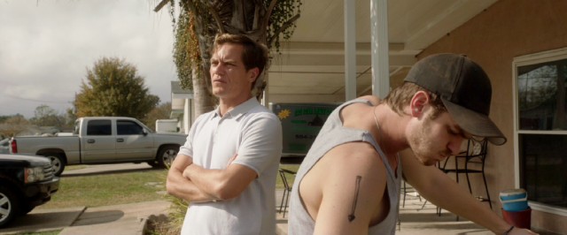 In "99 Homes", Dennis (Andrew Garfield) has no better choice than to work for Rick Carver (Michael Shannon), the slimeball who evicted his family.