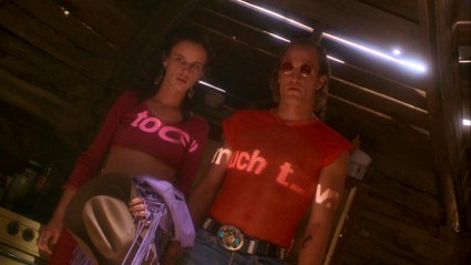 In "Natural Born Killers", one possible explanation for their cross-country murder spree is projected onto the chests of Mallory (Juliette Lewis) and Mickey (Woody Harrelson).