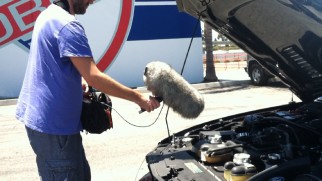 A sound guy uses a fluffy microphone to record a powerful car engine in "The Sound of 'Need for Speed.'"