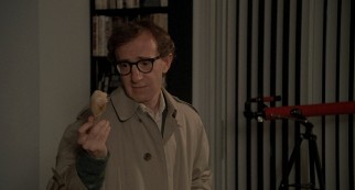 Sheldon Mills (Woody Allen) holds and reflects upon a boiled chicken leg that reminds him of his mother in "Oedipus Wrecks."