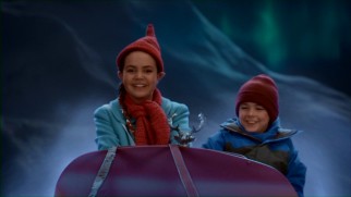 Friendless Kevin (Max Charles) gets to visit the Northpole in a one-reindeer sled driven by the elf Clementine (Bailee Madison).