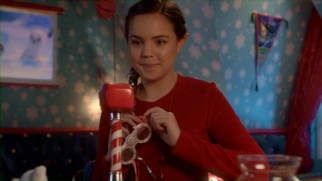 SnowMG! Clementine (Bailee Madison) uses a Northpole Communicator (available now from Northpole1820.com) to communicate with Kevin.