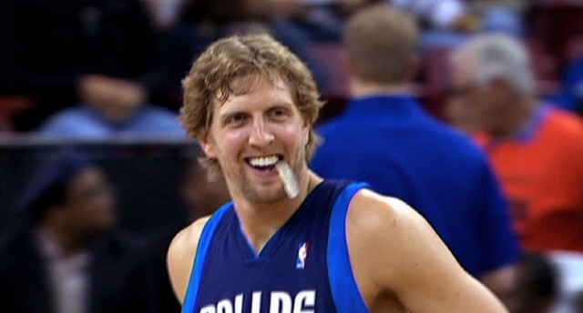 A smiling Dirk Nowitzki lets his mouthguard hang during one of his 1,300 and counting games played for the Dallas Mavericks.