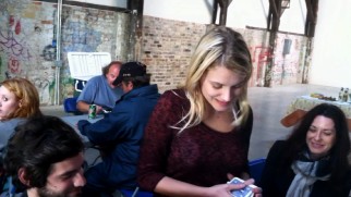 Actress Mélanie Laurent entertains herself with a deck of cards on the set of "Now You See Me."