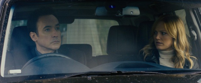 Emerson Kent (John Cusack) and Katherine (Malin Akerman) sense something is wrong at their workplace in "The Numbers Station."