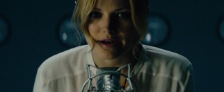 Malin Akerman is Katherine, a civilian "broadcaster" of encrypted number codes.