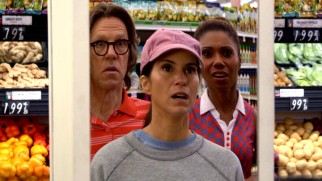 Larry, Debbie, and Jackie are surprised by the view in a grocery store mirror.