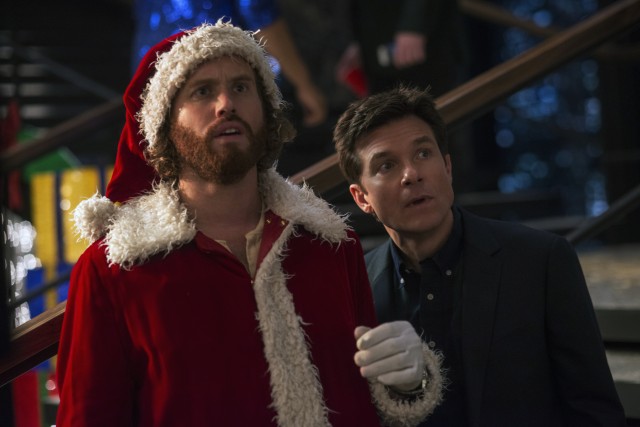 Clay Vanstone (T.J. Miller) and Josh Parker (Jason Bateman) throw an office Christmas party in "Office Christmas Party."