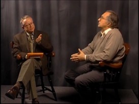 Author John W. Kiser (right) ponders his answer to the question that Merrimack College philosophy professor George Heffernan asks.
