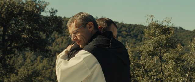 In front of Morocco playing Algeria, Brother Christian (Lambert Wilson) gives his fellow monk a great hug. Ah, the greatest hug!
