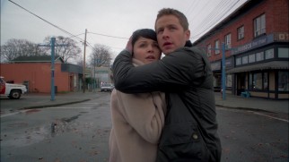 Mary Margaret (Ginnifer Goodwin) and David (Josh Dallas) brace for the purple CGI smoke coming their way in the first season finale.
