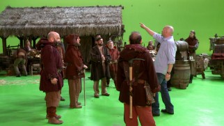 Dwarfs get directed on a green screen set in "Fairy Tales in the Modern World."