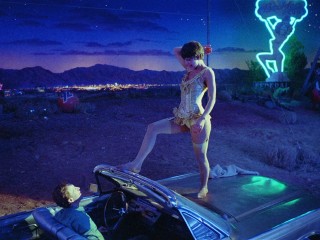 As circus tightrope artist Leila, Nastassja Kinski puts on a little show for Hank (Frederic Forrest) in the junkyard where he works.