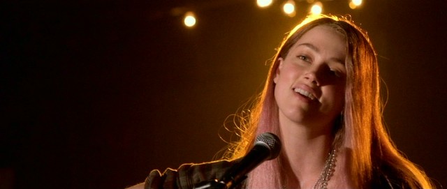 Told she's squandering her talent, Jude (Amber Heard) sings an original song at an open mic night.