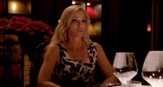 Grieving mother Crystal (Kristin Scott Thomas) contrasts her sons' genitalia in a one-sided dinner conversation with Julian and the prostitute posing as his girlfriend.