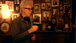 Writer-director Jim Jarmusch takes his place in front of a wall of geniuses in the making-of documentary "Travelling at Night."