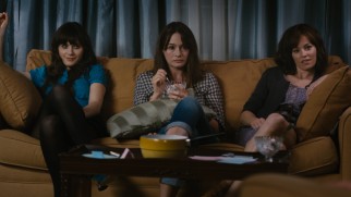 Things get real for Ned's three sisters (Zooey Deschanel, Emily Mortimer, and Elizabeth Banks) during a strained family game of charades.
