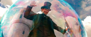 Oz (James Franco) waves to his would-be subjects from an airborne bubble.