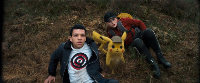 A human man (Justice Smith), his father's Pikachu (voiced by Ryan Reynolds), and an aspiring reporter (Kathryn Newton) go digging for answers in "Pokmon: Detective Pikachu."