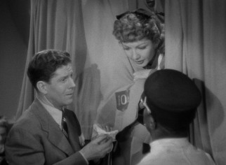 After the rowdy train car holding all her possessions is disconnected, Gerry (Claudette Colbert) is in need of clothes and the generosity of the wealthy John D. Hackensacker III (Rudy Vallee).