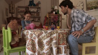 At a tea party, Dennis (Chris Brown) asks Kristi (Jessica Brown) about her friend, not Teddy Ruxpin, but the invisible one.