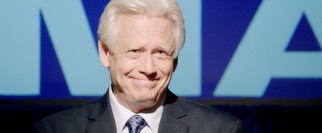 Senator Donald Harrison (Bruce Davison) puts on a happy face, knowing his Faith and Fairness Act is sure to pass with opponent John Luther disgraced.