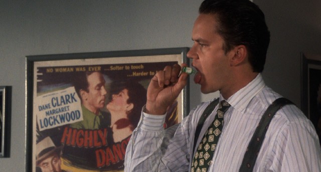 Griffin Mill (Tim Robbins) takes a drop of Binaca in "The Player."
